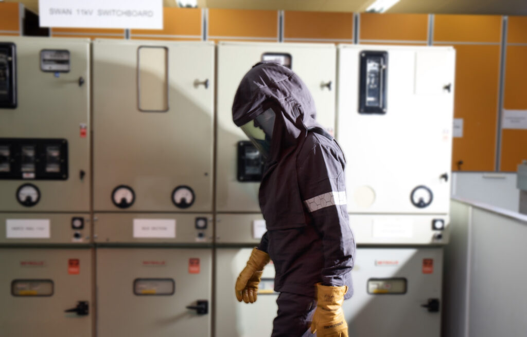 Engineer wearing an Arc 4 Switching Suit